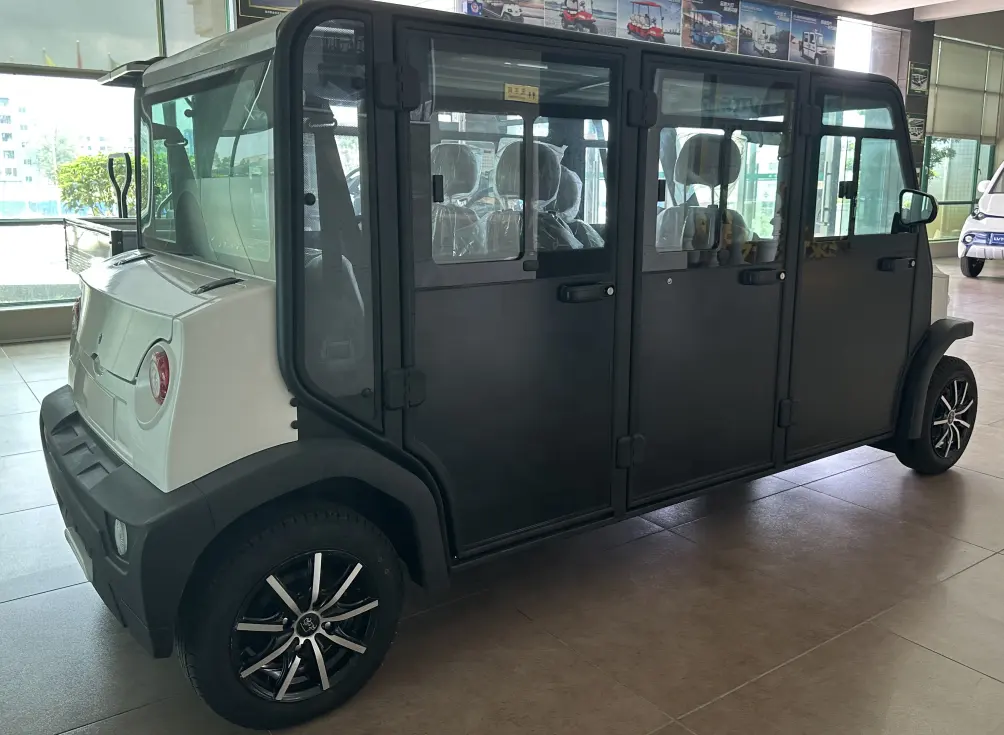 Small electric vehicle in a showroom setting