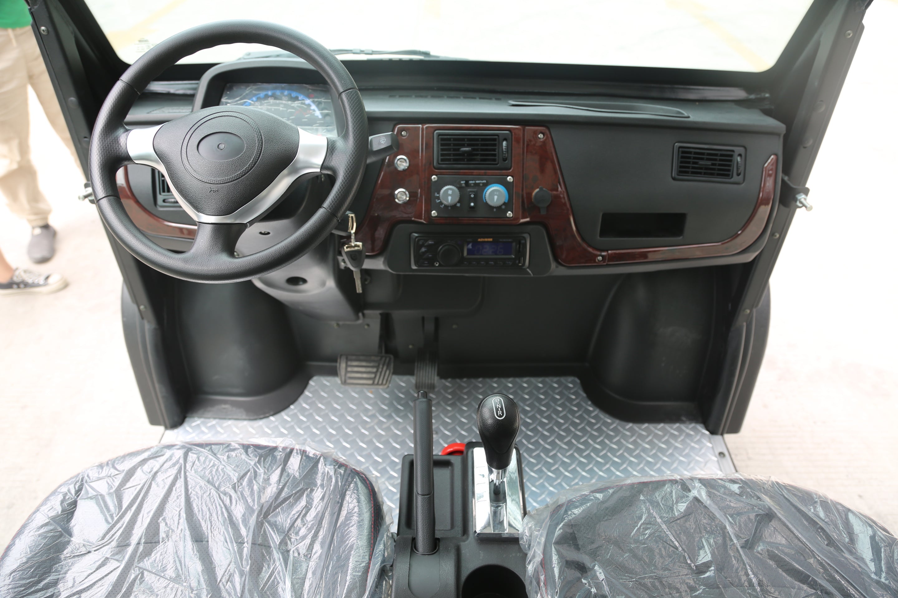 Car interior with steering wheel and dashboard view