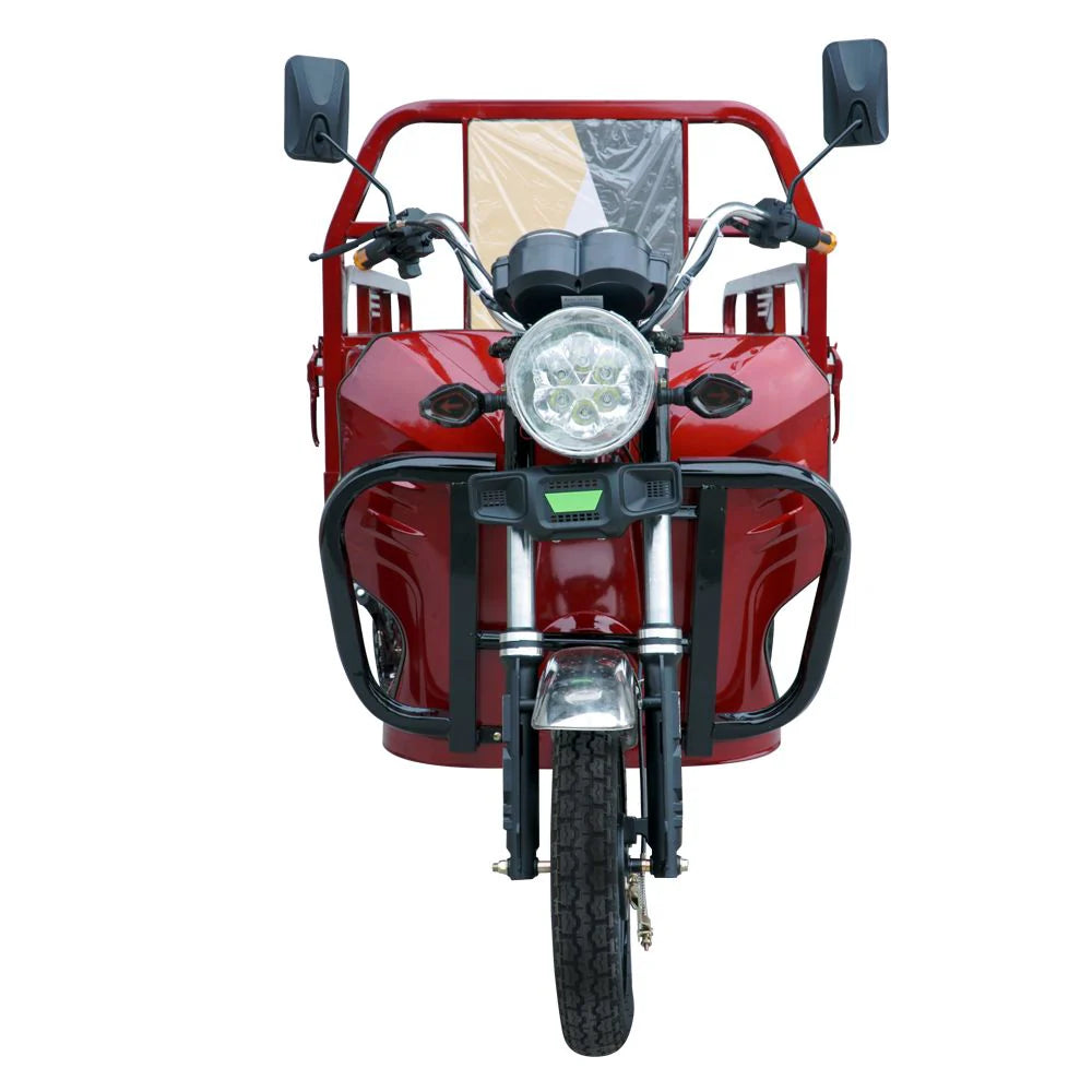 Red tricycle with a front light on a white background