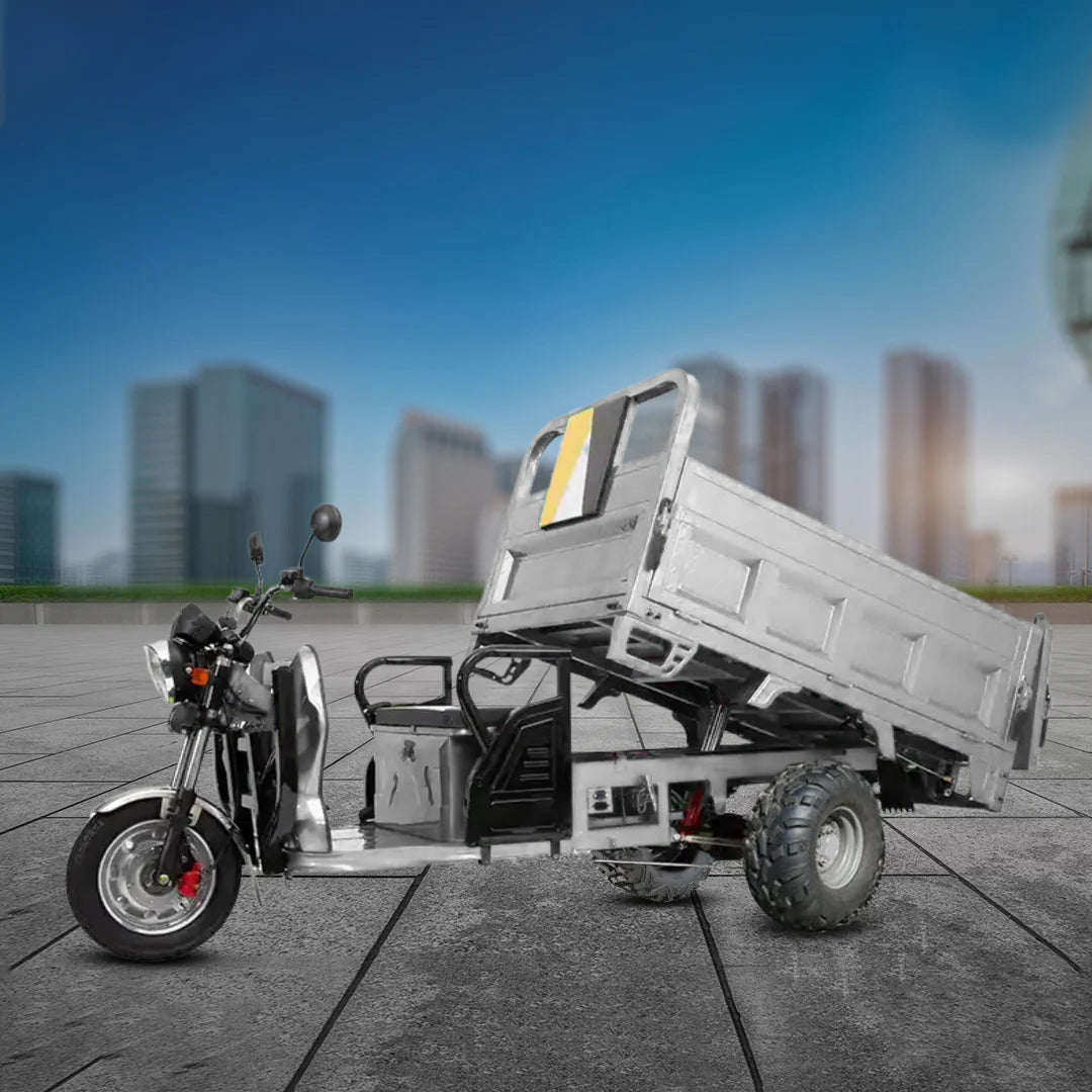 Motorcycle and small truck on a city street with buildings in the background
