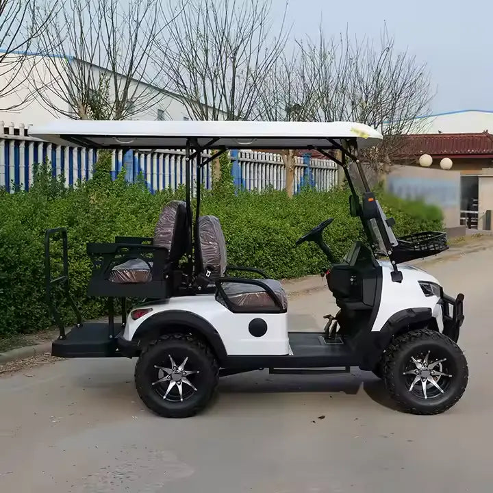 White golf cart with black accents parked on a driveway.