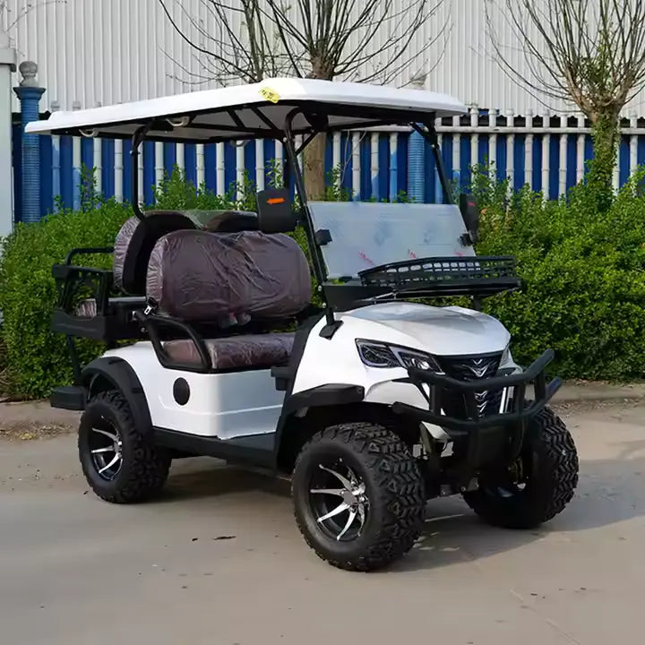 White golf cart with black tires parked on a concrete surface.