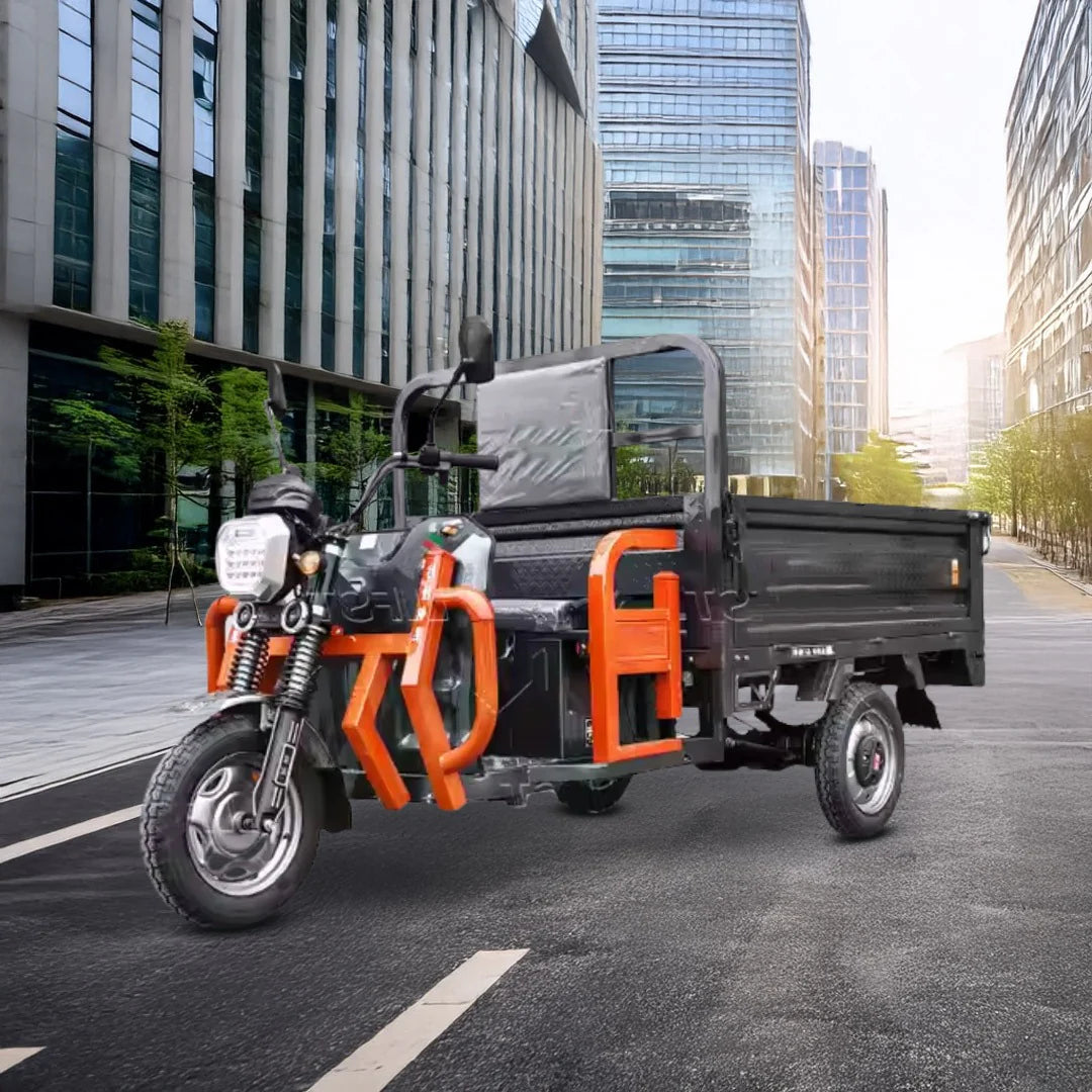 Three-wheeled vehicle with a cargo bed on a city street