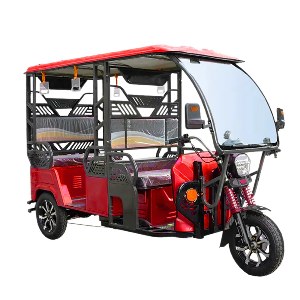 Red three-wheeled motor vehicle with a canopy on a white background