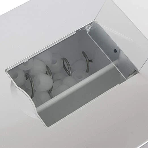 Close-up of a white appliance with a transparent door showing internal components.