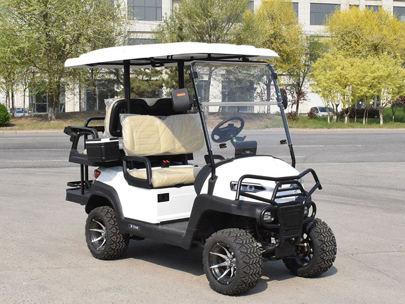 White golf cart with a canopy on a paved road.